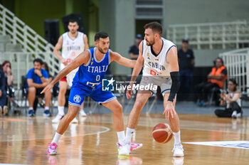 2023-08-09 - 23 MARKO GUDURIC of Serbia competing with 0 MARCO SPISSU of Italy during the Aegean Acropolis Tournament match between Italy and Serbia at Oaka Stadium on August 9, 2023, in Athens, Greece. - AEGEAN ACROPOLIS TOURNAMENT - SERBIA VS ITALY - INTERNATIONALS - BASKETBALL