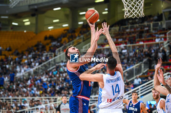 2023-08-08 - 33 NIKOLA MILUTINOV of Serbia competing with 14 GEORGIOS PAPAGIANNIS of Greece during the Aegean Acropolis Tournament match between Greece and Serbia at Oaka Stadium on August 8, 2023, in Athens, Greece. - AEGEAN ACROPOLIS TOURNAMENT - GREECE VS SERBIA - INTERNATIONALS - BASKETBALL