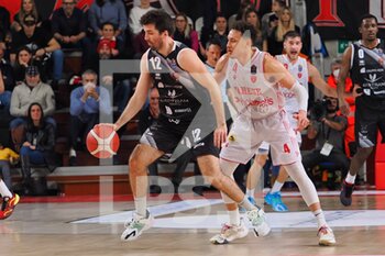 2023-01-02 - Ariel Filloy (Bertram Yachts Derthona Tortona) thwarted by Colbey Ross (Openjobmetis Varese)  - OPENJOBMETIS VARESE VS BERTRAM YACHTS DERTHONA TORTONA - ITALIAN SERIE A - BASKETBALL