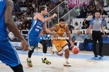 2023-10-01 - Ray McCallum of Carpegna Prosciutto Pesaro contrasted by Amedeo Della Valle of Germani Basket Brescia in during the match between Germani Basket Brescia and Carpegna Prosciutto Pesaro, regular season of A1 Italian Basketball Championship 2023/2024 at PalaLeonessa A2A on October 1, 2023, Brixia, Italy. - GERMANI BRESCIA VS CARPEGNA PROSCIUTTO PESARO - ITALIAN SERIE A - BASKETBALL