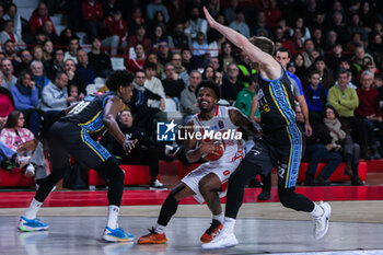 2023-12-03 - Vinnie Shahid #0 of Pallacanestro Varese OpenJobMetis (C) competes for the ball against Paul Eboua #00 of Vanoli Basket Cremona (L) and Wayne McCullough #22 of Vanoli Basket Cremona (R) during LBA Lega Basket A 2023/24 Regular Season game between Pallacanestro Varese OpenJobMetis and Vanoli Basket Cremona at Itelyum Arena, Varese, Italy on December 03, 2023 - OPENJOBMETIS VARESE VS VANOLI BASKET CREMONA - ITALIAN SERIE A - BASKETBALL