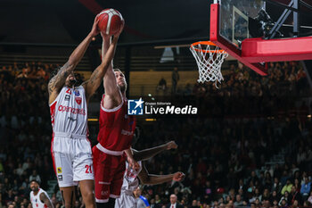 2023-12-17 - Nicolo Melli #9 of EA7 Emporio Armani Milan (R) competes for the ball against Olivier Hanlan #21 of Pallacanestro Varese OpenJobMetis (L) during LBA Lega Basket A 2023/24 Regular Season game between Pallacanestro Varese OpenJobMetis and EA7 Emporio Armani Milan at Itelyum Arena, Varese, Italy on December 17, 2023 - OPENJOBMETIS VARESE VS EA7 EMPORIO ARMANI MILANO - ITALIAN SERIE A - BASKETBALL
