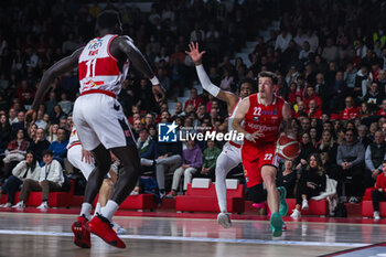 2023-12-29 - (R-L) Sean Mcdermott #22 of Pallacanestro Varese OpenJobMetis seen in action with Langston Galloway #9 of Unahotels Reggio Emilia and Mouhamed Faye #11 of Unahotels Reggio Emilia during LBA Lega Basket A 2023/24 Regular Season game between Pallacanestro Varese OpenJobMetis and Unahotels Reggio Emilia at Itelyum Arena, Varese, Italy on December 29, 2023 - OPENJOBMETIS VARESE VS UNAHOTELS REGGIO EMILIA - ITALIAN SERIE A - BASKETBALL