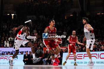 2023-12-29 - Olivier Hanlan #21 of Pallacanestro Varese OpenJobMetis (C) seen in action with Briante Webwe #2 of Unahotels Reggio Emilia (L), Niccolo Mannion #4 of Pallacanestro Varese OpenJobMetis (2R) and Michele Vitali #31 of Unahotels Reggio Emilia (R) during LBA Lega Basket A 2023/24 Regular Season game between Pallacanestro Varese OpenJobMetis and Unahotels Reggio Emilia at Itelyum Arena, Varese, Italy on December 29, 2023 - OPENJOBMETIS VARESE VS UNAHOTELS REGGIO EMILIA - ITALIAN SERIE A - BASKETBALL