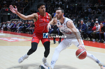 2023-12-23 - Riccardo Bolpin (Fortitudo Flats Services Bologna) thwarted by Eli Jameson Brooks (Pallacanestro Trieste) during the italian basketball LBN A2 series championship match Fortitudo Flats Services Bologna Vs Pallacanestro Trieste - Bologna, Italy, December 23, 2023 at Paladozza sports hall - Photo: Michele Nucci - FORTITUDO BOLOGNA VS TRIESTE - ITALIAN SERIE A2 - BASKETBALL