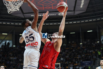 2023-12-23 - Stefano Bossi (Pallacanestro Trieste) thwarted by Mark Ogden (Fortitudo Flats Services Bologna) during the italian basketball LBN A2 series championship match Fortitudo Flats Services Bologna Vs Pallacanestro Trieste - Bologna, Italy, December 23, 2023 at Paladozza sports hall - Photo: Michele Nucci - FORTITUDO BOLOGNA VS TRIESTE - ITALIAN SERIE A2 - BASKETBALL