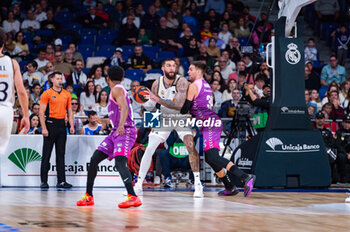 2023-11-26 - Vincent Poirier of Real Madrid and Marin Maric of Morabanc Andorra seen in action with the ball during the ACB Spanish league match between Real Madrid and Morabanc Andorra at Wizink Center in Madrid, Spain. - REAL MADRID VS MORABANC ANDORRA - SPANISH LIGA ENDESA ACB - BASKETBALL