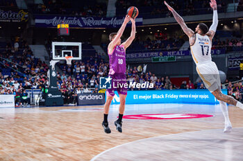 2023-11-26 - Adam Somogyi of Morabanc Andorra seen in action against Vincent Poirier of Real Madrid during the ACB Spanish league match between Real Madrid and Morabanc Andorra at Wizink Center in Madrid, Spain. - REAL MADRID VS MORABANC ANDORRA - SPANISH LIGA ENDESA ACB - BASKETBALL