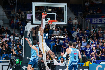 2023-12-03 - Vincent Poirier of Real Madrid seen taking a dunk during the Liga Endesa Acb 23/24 basketball match between Real Madrid vs Rio Breogan at Wizink center in Madrid, Spain. - REAL MADRID VS BREOGAN - SPANISH LIGA ENDESA ACB - BASKETBALL