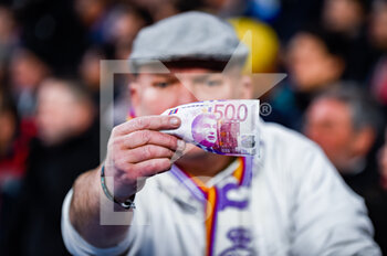 2023-03-02 - A Real Madrid fan protest against the corruption case involving Barcelona football team showing a banknote with the face of president Joan Laporta during the football match between
Real Madrid and Barcelona valid for the semifinal of the “Copa del Rey” Spanish cup celebrated in Madrid, Spain at Bernabeu stadium on Thursday 02 March 2023 - REAL MADRID VS BARCELONA - SPANISH CUP - SOCCER