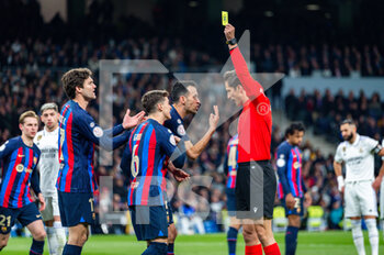 2023-03-02 - Sergio Busquets (Barcelona) protesting with the referee during the football match between
Real Madrid and Barcelona valid for the semifinal of the “Copa del Rey” Spanish cup celebrated in Madrid, Spain at Bernabeu stadium on Thursday 02 March 2023 - REAL MADRID VS BARCELONA - SPANISH CUP - SOCCER