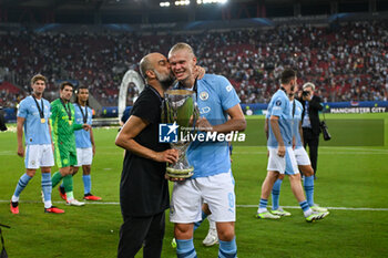 16/08/2023 - Happiness of Manchester City’s Erling Haaland and Head Coach Pep Guardiola after win the UEFA Super Cup 2023 final soccer match between Manchester City F.C. vs. Sevilla F.C. at the Stadio Georgios Karaiskakis-Piraeus in Athens, Greece, 16th of August 2023 - EUROPEAN SUPER CUP MANCHESTER CITY VS SEVILLE - SUPERCOPPA EUROPEA - CALCIO