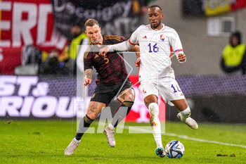 2023-03-28 - Dodi Lukebakio of Belgium and David Raum of Germany during the International Friendly football match between Germany and Belgium on March 28, 2023 at RheinEnergieStadion in Cologne, Germany - FOOTBALL - FRIENDLY GAME - GERMANY V BELGIUM - FRIENDLY MATCH - SOCCER