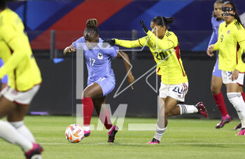 2023-04-07 - Sandy Baltimore of France, Monica Ramos of Colombia during the Women's Friendly football match between France and Colombia on April 7, 2023 at Stade Gabriel-Montpied in Clermont-Ferrand, France - FOOTBALL - WOMEN'S FRIENDLY GAME - FRANCE V COLOMBIA - FRIENDLY MATCH - SOCCER