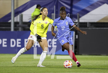 2023-04-07 - Sandy Baltimore of France, Lorena Bedoya of Colombia (left) during the Women's Friendly football match between France and Colombia on April 7, 2023 at Stade Gabriel-Montpied in Clermont-Ferrand, France - FOOTBALL - WOMEN'S FRIENDLY GAME - FRANCE V COLOMBIA - FRIENDLY MATCH - SOCCER