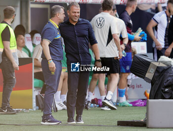 2023-06-12 - Coach Serhiy Rebrov of Ukraine and Coach Hansi Flick of Germany during the Friendly football match between Germany and Ukraine on June 12, 2023 at Weserstadion in Bremen, Germany - FOOTBALL - FRIENDLY GAME - GERMANY V UKRAINE - FRIENDLY MATCH - SOCCER