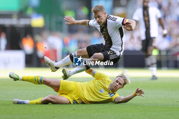 2023-06-12 - Joshua Kimmich of Germany and Mykhaylo Mudryk of Ukraine during the Friendly football match between Germany and Ukraine on June 12, 2023 at Weserstadion in Bremen, Germany - FOOTBALL - FRIENDLY GAME - GERMANY V UKRAINE - FRIENDLY MATCH - SOCCER