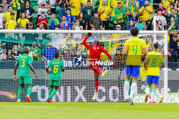 2023-06-20 - Lucas Paqueta of Brazil scores a goal 1-0, goalkeeper Mory Diaw of Senegal during the International Friendly Football match between Brazil and Senegal on June 20, 2023 at Jose Alvalade stadium in Lisbon, Portugal - FOOTBALL - FRIENDLY GAME - BRAZIL V SENEGAL - FRIENDLY MATCH - SOCCER