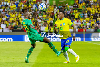 2023-06-20 - Vinicius Junior of Brazil and Youssouf Sabaly of Senegal during the International Friendly Football match between Brazil and Senegal on June 20, 2023 at Jose Alvalade stadium in Lisbon, Portugal - FOOTBALL - FRIENDLY GAME - BRAZIL V SENEGAL - FRIENDLY MATCH - SOCCER