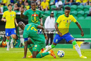2023-06-20 - Vinicius Junior of Brazil and Kalidou Koulibaly of Senegal during the International Friendly Football match between Brazil and Senegal on June 20, 2023 at Jose Alvalade stadium in Lisbon, Portugal - FOOTBALL - FRIENDLY GAME - BRAZIL V SENEGAL - FRIENDLY MATCH - SOCCER