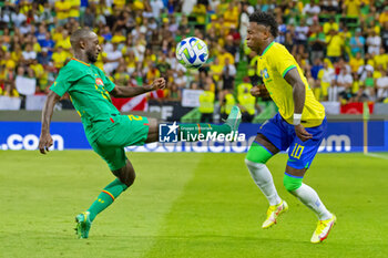2023-06-20 - Vinicius Junior of Brazil and Youssouf Sabaly of Senegal during the International Friendly Football match between Brazil and Senegal on June 20, 2023 at Jose Alvalade stadium in Lisbon, Portugal - FOOTBALL - FRIENDLY GAME - BRAZIL V SENEGAL - FRIENDLY MATCH - SOCCER