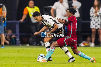 2023-06-20 - Jamal Musiala of Germany and Juan Cuadrado of Colombia during the International Friendly football match between Germany and Colombia on June 20, 2023 at the Veltins-Arena in Gelsenkirchen, Germany - FOOTBALL - FRIENDLY GAME - GERMANY V COLOMBIA - FRIENDLY MATCH - SOCCER