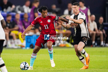 2023-06-20 - Juan Cuadrado of Colombia battle for possession with Robin Gosens of Germany during the International Friendly football match between Germany and Colombia on June 20, 2023 at the Veltins-Arena in Gelsenkirchen, Germany - FOOTBALL - FRIENDLY GAME - GERMANY V COLOMBIA - FRIENDLY MATCH - SOCCER