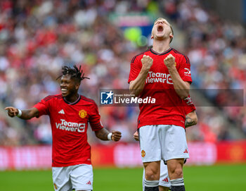 2023-07-19 - Donny Van De Beek of Manchester United celebrates after scoring the opening goal 1-0 during the pre-season friendly football match between Manchester United and Olympique Lyonnais (Lyon) on 19 July 2023 at the Scottish Gas Murrayfield Stadium in Edinburgh, Scotland - FOOTBALL - FRIENDLY GAME - MANCHESTER UNITED V LYON - FRIENDLY MATCH - SOCCER