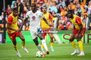 2023-08-02 - Andy DIOUF of Lens, Demba SECK of Torino and Kevin DANSO of Lens during the pre-season friendly football match between RC Lens and Torino FC on August 2, 2023 at Bollaert-Delelis stadium in Lens, France - FOOTBALL - FRIENDLY GAME - LENS V TORINO - FRIENDLY MATCH - SOCCER