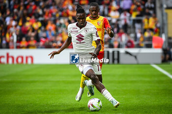 2023-08-02 - Stephane SINGO of Torino and David PEREIRA DA COSTA of Lens during the pre-season friendly football match between RC Lens and Torino FC on August 2, 2023 at Bollaert-Delelis stadium in Lens, France - FOOTBALL - FRIENDLY GAME - LENS V TORINO - FRIENDLY MATCH - SOCCER