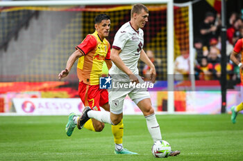 2023-08-02 - Florian SOTOCA of Lens and Perr SCHUURS of Torino during the pre-season friendly football match between RC Lens and Torino FC on August 2, 2023 at Bollaert-Delelis stadium in Lens, France - FOOTBALL - FRIENDLY GAME - LENS V TORINO - FRIENDLY MATCH - SOCCER