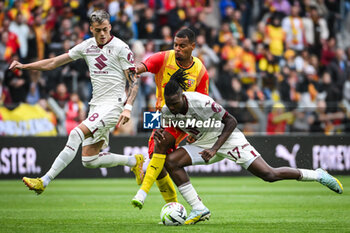 2023-08-02 - Ivan ILIC of Torino, Andy DIOUF of Lens and Stephane SINGO of Torino during the pre-season friendly football match between RC Lens and Torino FC on August 2, 2023 at Bollaert-Delelis stadium in Lens, France - FOOTBALL - FRIENDLY GAME - LENS V TORINO - FRIENDLY MATCH - SOCCER