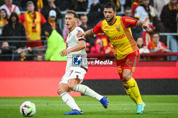 2023-08-02 - Mergim VOJVODA of Torino and Julien LE CARDINAL of Lens during the pre-season friendly football match between RC Lens and Torino FC on August 2, 2023 at Bollaert-Delelis stadium in Lens, France - FOOTBALL - FRIENDLY GAME - LENS V TORINO - FRIENDLY MATCH - SOCCER