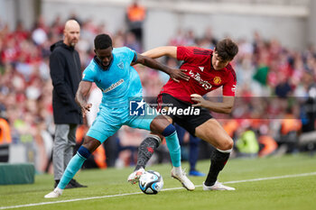 2023-08-06 - Inaki Williams of Athletic Club competes for the ball with Harry Maguire of Manchester United during the pre-season friendly football match between Manchester United and Athletic Club on August 6, 2023 at Aviva Stadium in Dublin, Ireland - FOOTBALL - FRIENDLY GAME - MANCHESTER UNITED V ATHLETIC CLUB - FRIENDLY MATCH - SOCCER