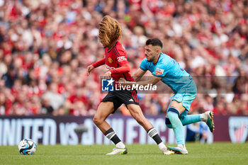 2023-08-06 - Hannibal Mejbri of Manchester United competes for the ball with Aitor Paredes of Athletic Club during the pre-season friendly football match between Manchester United and Athletic Club on August 6, 2023 at Aviva Stadium in Dublin, Ireland - FOOTBALL - FRIENDLY GAME - MANCHESTER UNITED V ATHLETIC CLUB - FRIENDLY MATCH - SOCCER