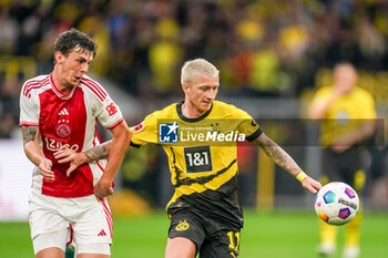 2023-08-06 - Marco Reus of Borussia Dortmund is challenged by Benjamin Tahirovic of Ajax during the Pre-season Friendly football match between Borussia Dortmund and Ajax on August 6, 2023 at Signal Iduna Park in Dortmund, Germany - FOOTBALL - FRIENDLY GAME - DORTMUND V AJAX - FRIENDLY MATCH - SOCCER