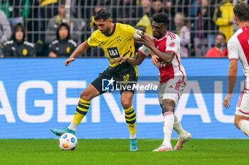 2023-08-06 - Emre Can of Borussia Dortmund is challenged by Mohammed Kudus of Ajax during the Pre-season Friendly football match between Borussia Dortmund and Ajax on August 6, 2023 at Signal Iduna Park in Dortmund, Germany - FOOTBALL - FRIENDLY GAME - DORTMUND V AJAX - FRIENDLY MATCH - SOCCER