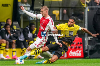 2023-08-06 - Kenneth Taylor of Ajax battles for the ball with Emre Can of Borussia Dortmund during the Pre-season Friendly football match between Borussia Dortmund and Ajax on August 6, 2023 at Signal Iduna Park in Dortmund, Germany - FOOTBALL - FRIENDLY GAME - DORTMUND V AJAX - FRIENDLY MATCH - SOCCER