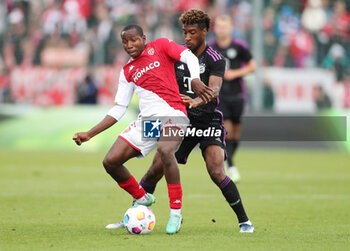 2023-08-07 - Mohamed Camara of Monaco and Kingsley Coman of Bayern Munich during the pre-season Friendly football match between FC Bayern Munich and AS Monaco on August 7, 2023 at Sportpark Unterhaching in Unterhaching, Germany - FOOTBALL - FRIENDLY GAME - BAYERN MUNICH V MONACO - FRIENDLY MATCH - SOCCER