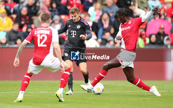 2023-08-07 - Josip Stanisic of Bayern Munich and Soungoutou Magassa of Monaco during the pre-season Friendly football match between FC Bayern Munich and AS Monaco on August 7, 2023 at Sportpark Unterhaching in Unterhaching, Germany - FOOTBALL - FRIENDLY GAME - BAYERN MUNICH V MONACO - FRIENDLY MATCH - SOCCER