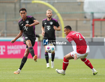 2023-08-07 - Jamal Musiala of Bayern Munich and Vanderson of Monaco during the pre-season Friendly football match between FC Bayern Munich and AS Monaco on August 7, 2023 at Sportpark Unterhaching in Unterhaching, Germany - FOOTBALL - FRIENDLY GAME - BAYERN MUNICH V MONACO - FRIENDLY MATCH - SOCCER