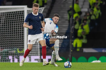 2023-09-12 - Declan Rice of England tries to get to the ball ahead of Scott McTominay of Scotland during the 150th Anniversary Heritage Match match between Scotland and England at The National Stadium, 12/09/2023, Hampden Park, Glasgow - FOOTBALL - FRIENDLY GAME - SCOTLAND V ENGLAND - FRIENDLY MATCH - SOCCER