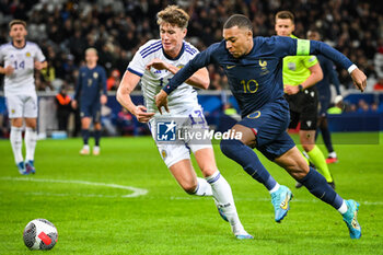 2023-10-17 - Jack HENDRY of Scotland and Kylian MBAPPE of France during the International Friendly football match between France and Scotland on October 17, 2023 at Pierre Mauroy stadium in Villeneuve-d'Ascq near Lille, France - FOOTBALL - FRIENDLY GAME - FRANCE V SCOTLAND - FRIENDLY MATCH - SOCCER