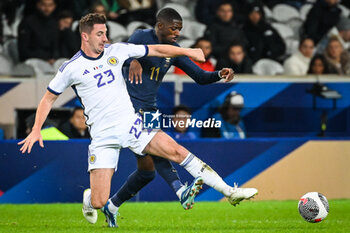 2023-10-17 - Kenny MCLEAN of Scotland and Ousmane DEMBELE of France during the International Friendly football match between France and Scotland on October 17, 2023 at Pierre Mauroy stadium in Villeneuve-d'Ascq near Lille, France - FOOTBALL - FRIENDLY GAME - FRANCE V SCOTLAND - FRIENDLY MATCH - SOCCER