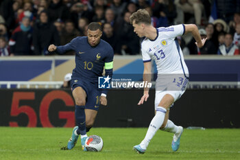 2023-10-17 - Kylian Mbappe of France, Jack Hendry of Scotland during the International Friendly football match between France and Scotland on October 17, 2023 at Stade Pierre Mauroy in Villeneuve-d'Ascq near Lille, France - FOOTBALL - FRIENDLY GAME - FRANCE V SCOTLAND - FRIENDLY MATCH - SOCCER