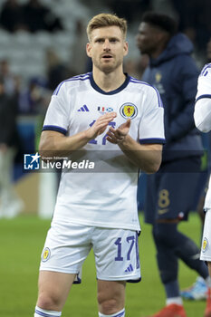 2023-10-17 - Stuart Armstrong of Scotland salutes the supporters following the International Friendly football match between France and Scotland on October 17, 2023 at Stade Pierre Mauroy in Villeneuve-d'Ascq near Lille, France - FOOTBALL - FRIENDLY GAME - FRANCE V SCOTLAND - FRIENDLY MATCH - SOCCER