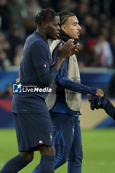 2023-10-17 - Castello Lukeba and Malo Gusto of France salute the supporters following the International Friendly football match between France and Scotland on October 17, 2023 at Stade Pierre Mauroy in Villeneuve-d'Ascq near Lille, France - FOOTBALL - FRIENDLY GAME - FRANCE V SCOTLAND - FRIENDLY MATCH - SOCCER