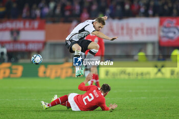 2023-11-21 - Joshua Kimmich of Germany and Maximilian Wober of Austria during the International Friendly football match between Austria and Germany on November 21, 2023 at Ernst Happel Stadium in Vienna, Austria - FOOTBALL - FRIENDLY GAME - AUSTRIA V GERMANY - FRIENDLY MATCH - SOCCER
