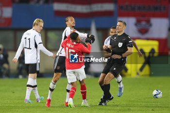 2023-11-21 - Clash between Leroy Sane of Germany and Phillipp Mwene of Austria during the International Friendly football match between Austria and Germany on November 21, 2023 at Ernst Happel Stadium in Vienna, Austria - FOOTBALL - FRIENDLY GAME - AUSTRIA V GERMANY - FRIENDLY MATCH - SOCCER