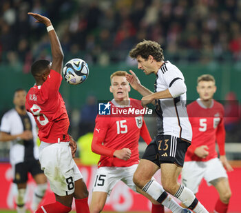 2023-11-21 - Thomas Müller of Germany and David Alaba of Austria during the International Friendly football match between Austria and Germany on November 21, 2023 at Ernst Happel Stadium in Vienna, Austria - FOOTBALL - FRIENDLY GAME - AUSTRIA V GERMANY - FRIENDLY MATCH - SOCCER